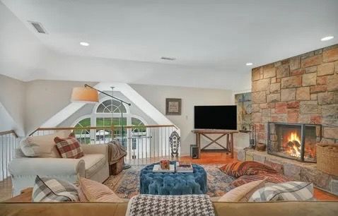 Great room with stone fireplace after a deep clean